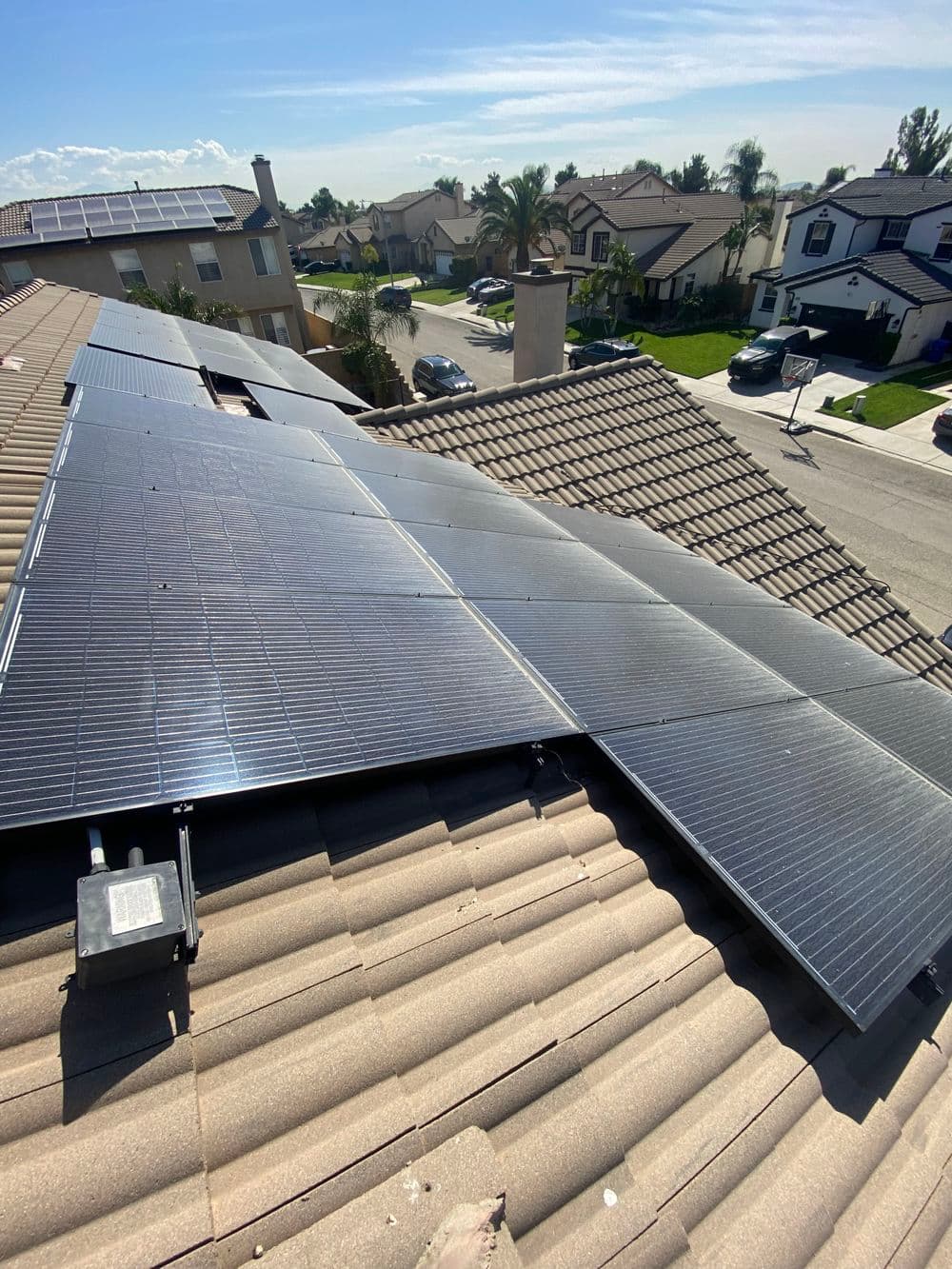 Solar panels installed on a residential roof, showcasing energy-efficient technology.